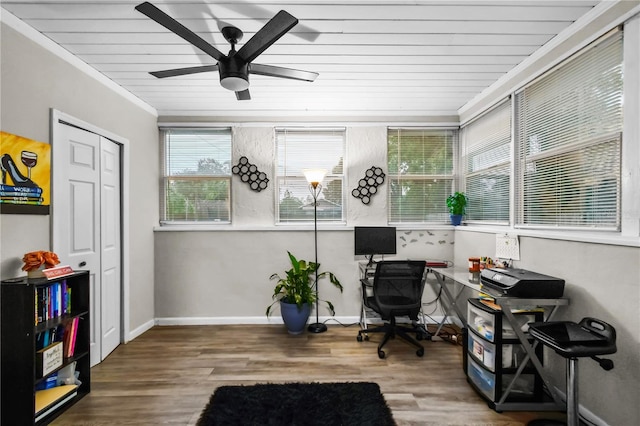 office space with ceiling fan, crown molding, wood-type flooring, and wooden ceiling