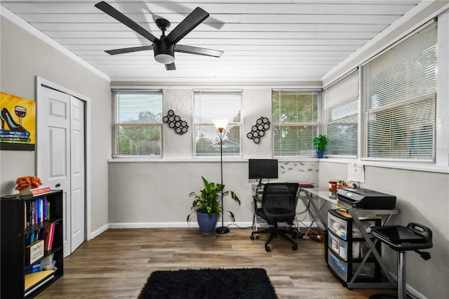 office with ornamental molding, a ceiling fan, wood finished floors, wooden ceiling, and baseboards