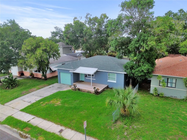 single story home featuring a front yard, roof with shingles, and driveway