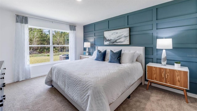 bedroom featuring light carpet