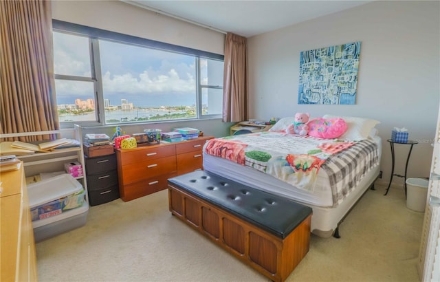 bedroom featuring light carpet