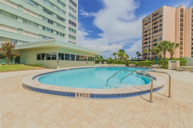 view of swimming pool featuring a patio