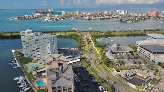 birds eye view of property with a view of city and a water view