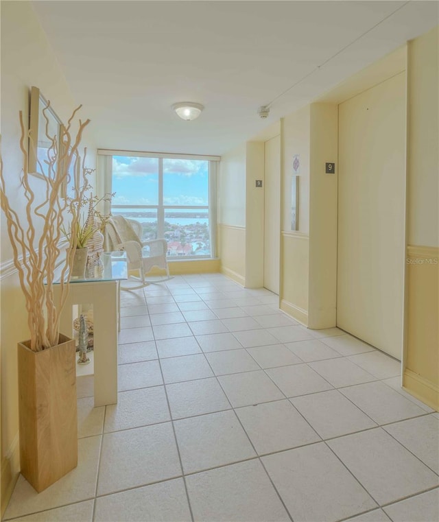 corridor featuring light tile patterned floors