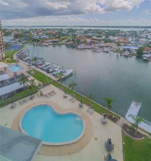 birds eye view of property with a water view