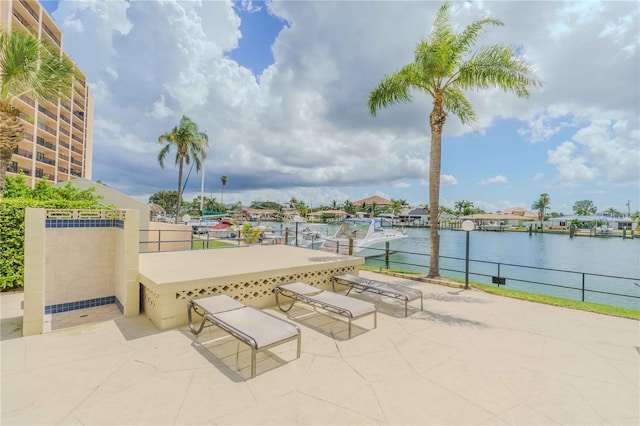 view of patio / terrace featuring a dock and a water view