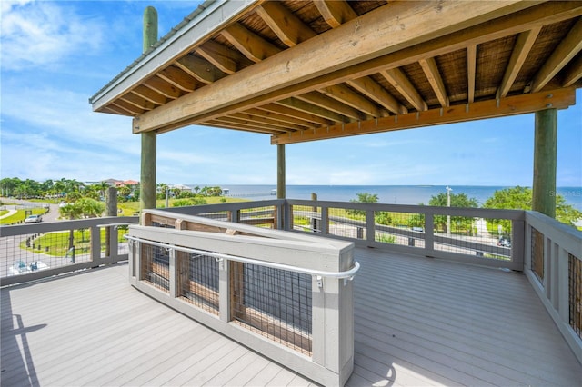 wooden deck featuring a water view