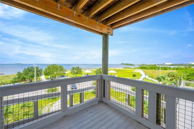 wooden deck with a water view