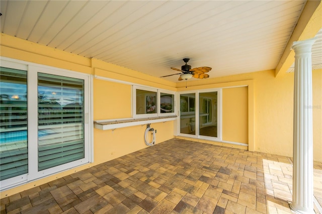 view of patio featuring ceiling fan