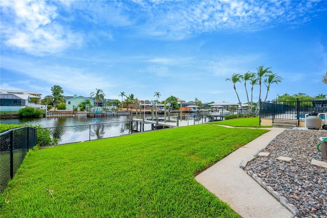 exterior space featuring a dock and a water view