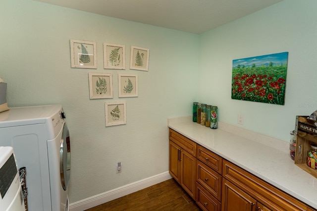 laundry area featuring dark wood-type flooring and washer and dryer