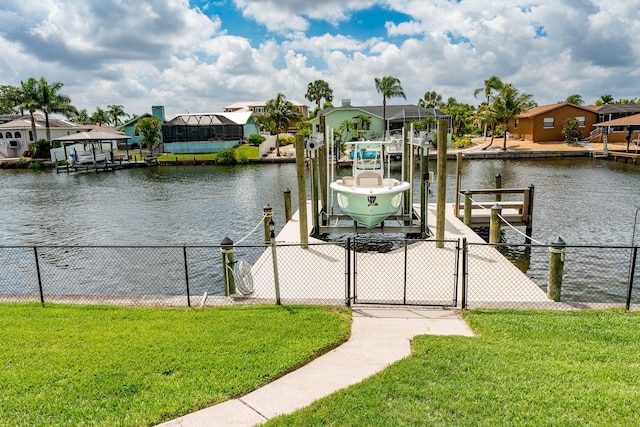 dock area featuring a yard and a water view