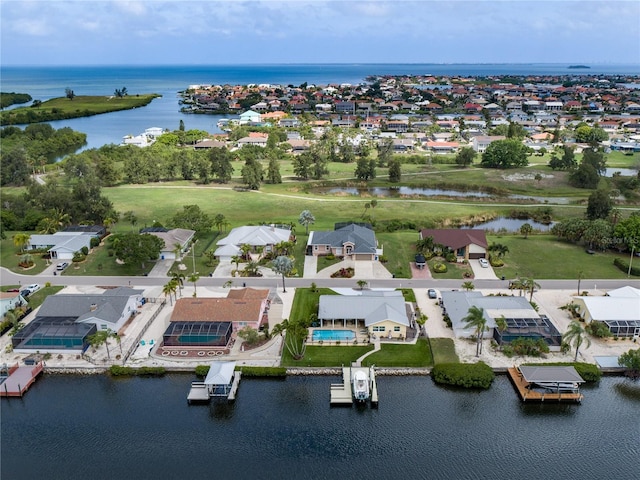 birds eye view of property featuring a water view