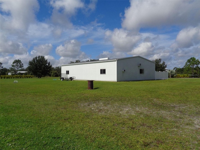 view of side of property with a yard