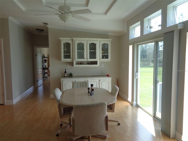 dining room featuring light wood-type flooring, ceiling fan, and a wealth of natural light