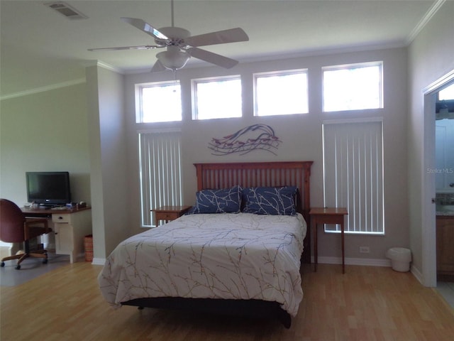 bedroom with crown molding, ceiling fan, and light wood-type flooring