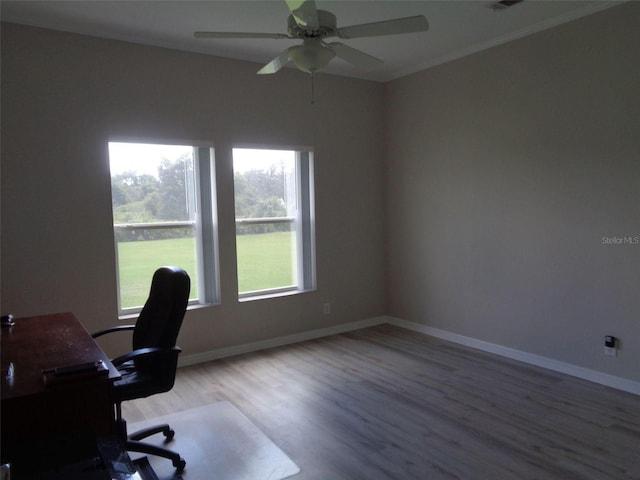 office area featuring ceiling fan, hardwood / wood-style flooring, and ornamental molding