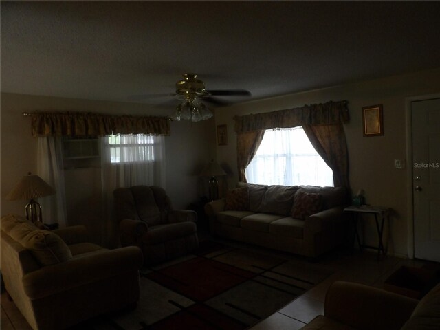 living room featuring ceiling fan and tile patterned floors