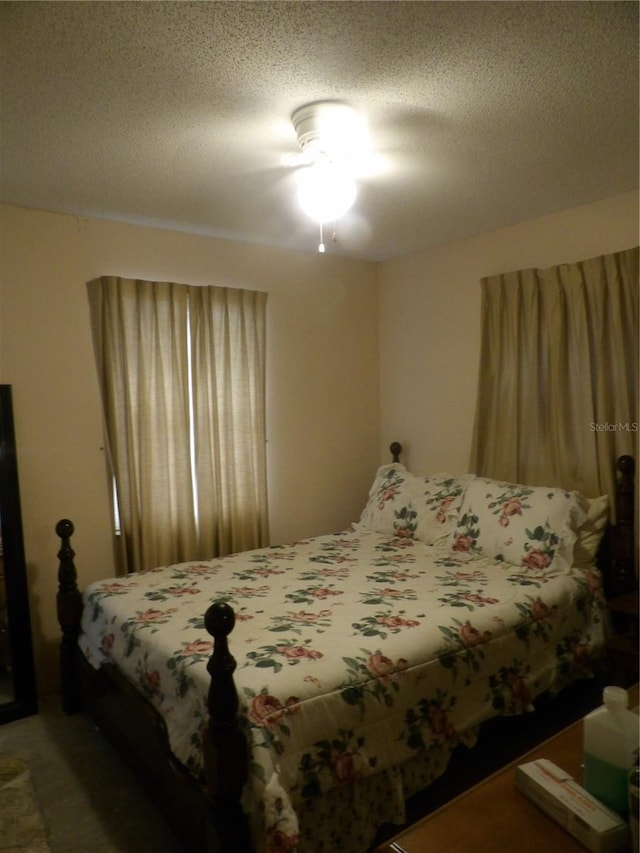 bedroom featuring a textured ceiling