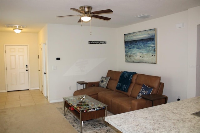 carpeted living room featuring ceiling fan