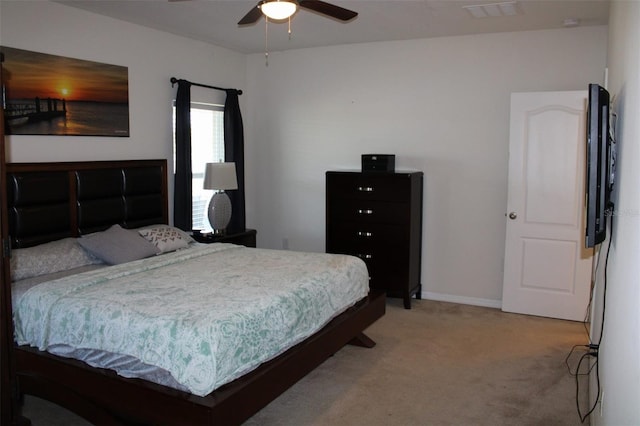 bedroom with ceiling fan and carpet floors