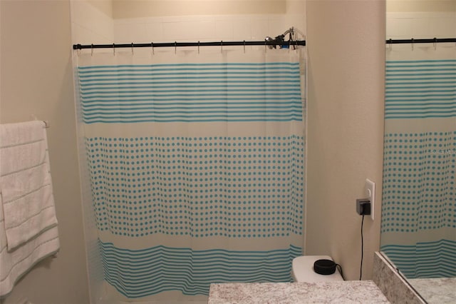 bathroom with a shower with shower curtain