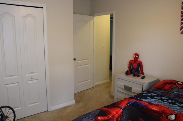 carpeted bedroom featuring a closet