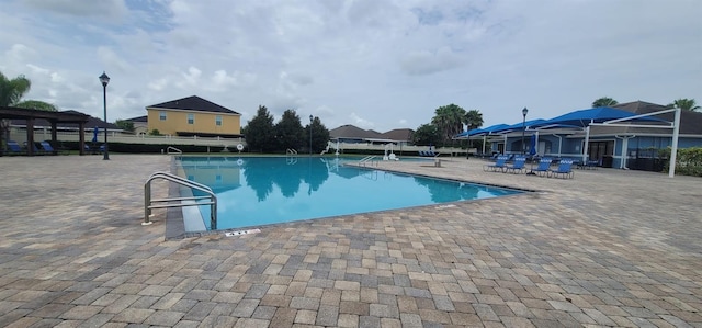 view of pool featuring a patio