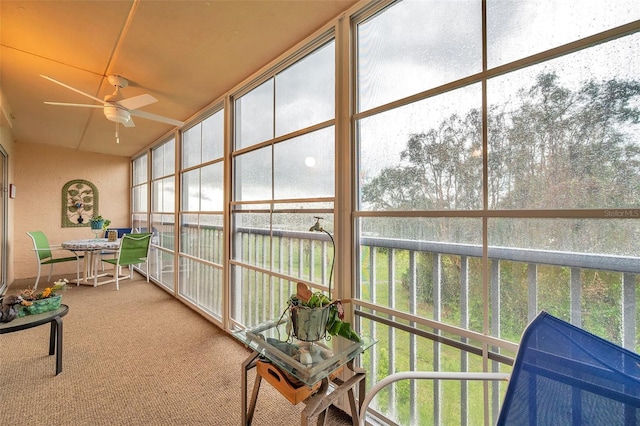 sunroom with ceiling fan and a healthy amount of sunlight