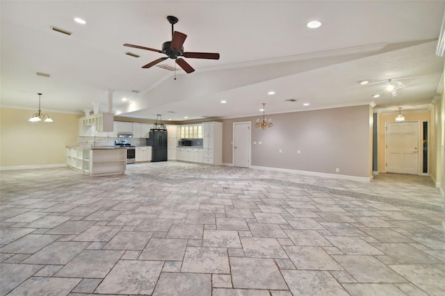 unfurnished living room featuring baseboards, vaulted ceiling, crown molding, and ceiling fan with notable chandelier