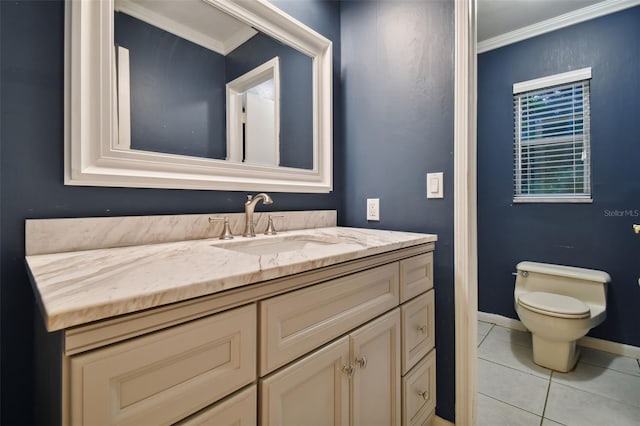 bathroom featuring baseboards, toilet, tile patterned flooring, crown molding, and vanity