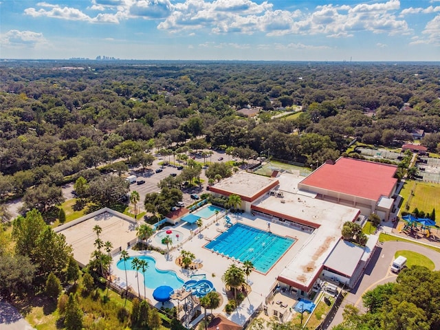 birds eye view of property featuring a wooded view