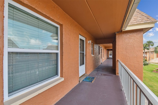 view of patio featuring a balcony