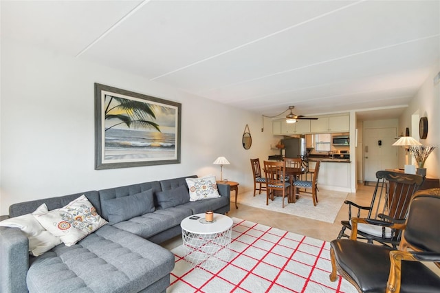 living room featuring light tile patterned floors and ceiling fan