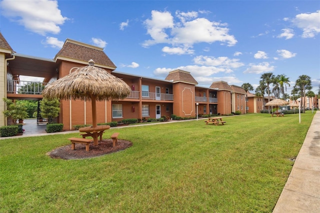 view of home's community featuring a lawn and a gazebo