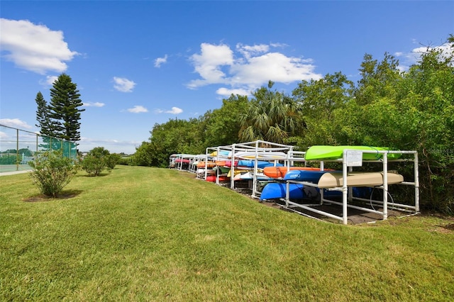 view of dock with a yard