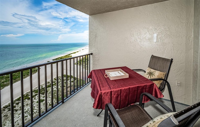 balcony with a view of the beach and a water view