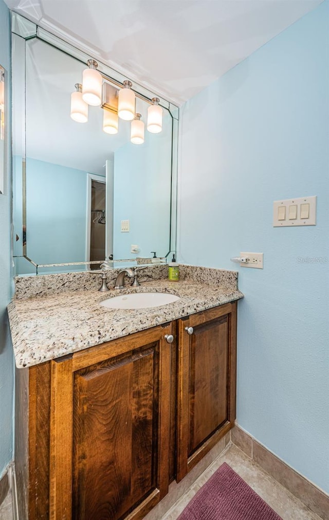 bathroom featuring tile patterned flooring and vanity