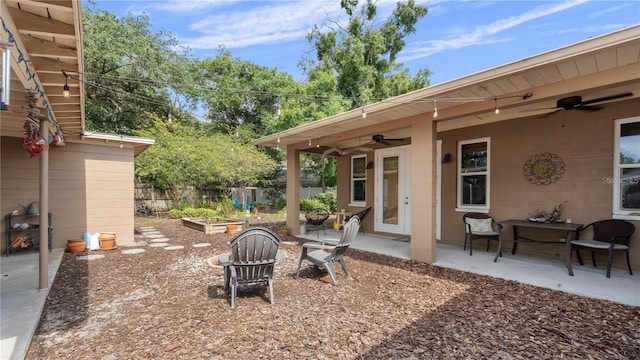 view of yard with a patio and ceiling fan