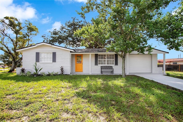 ranch-style home with a front yard and a garage