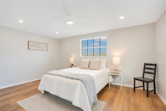 bedroom with ceiling fan and light wood-type flooring