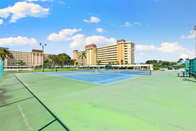 view of sport court featuring fence