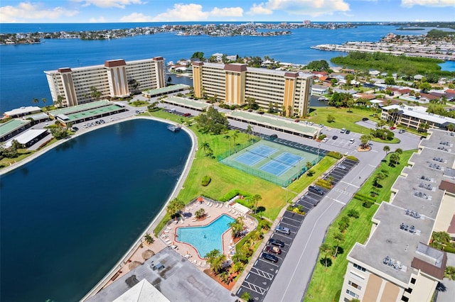 birds eye view of property with a water view