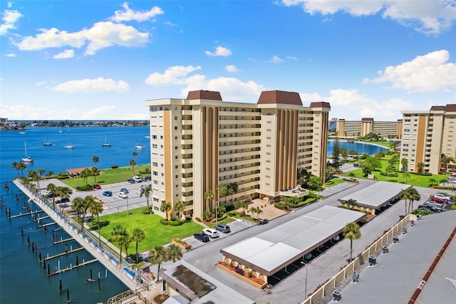 exterior space with a water view and a city view