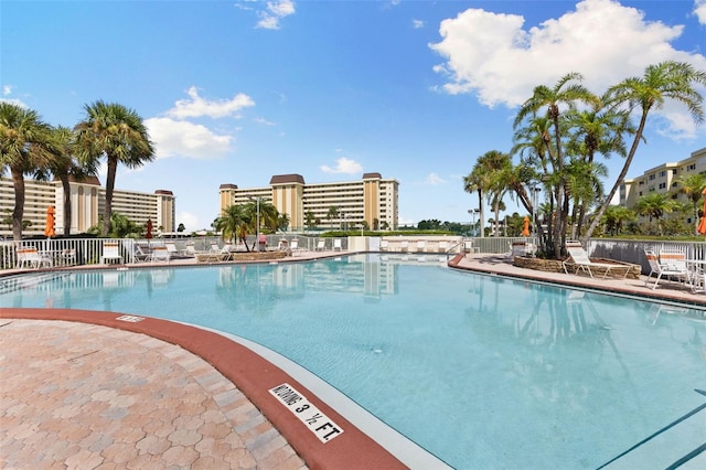 pool featuring a patio and fence