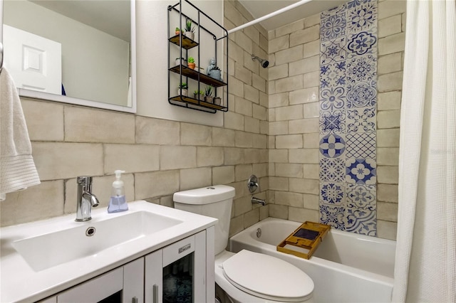 full bathroom featuring shower / bathtub combination with curtain, toilet, tile walls, decorative backsplash, and vanity