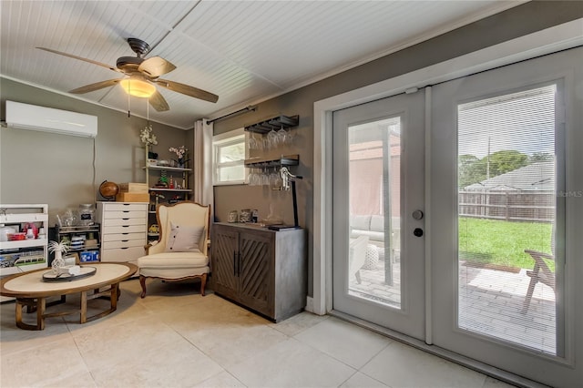 doorway to outside featuring light tile patterned floors, a healthy amount of sunlight, ceiling fan, and a wall mounted air conditioner