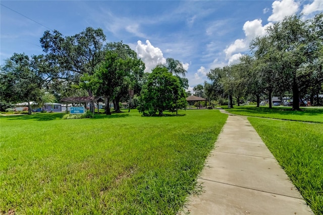 view of property's community featuring a yard and a gazebo