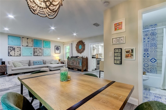 dining room with wood-type flooring