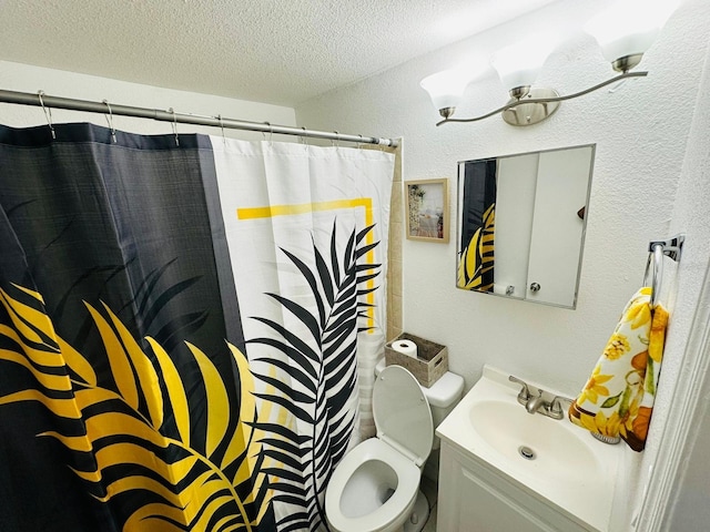 bathroom with a shower with curtain, vanity, toilet, and a textured ceiling